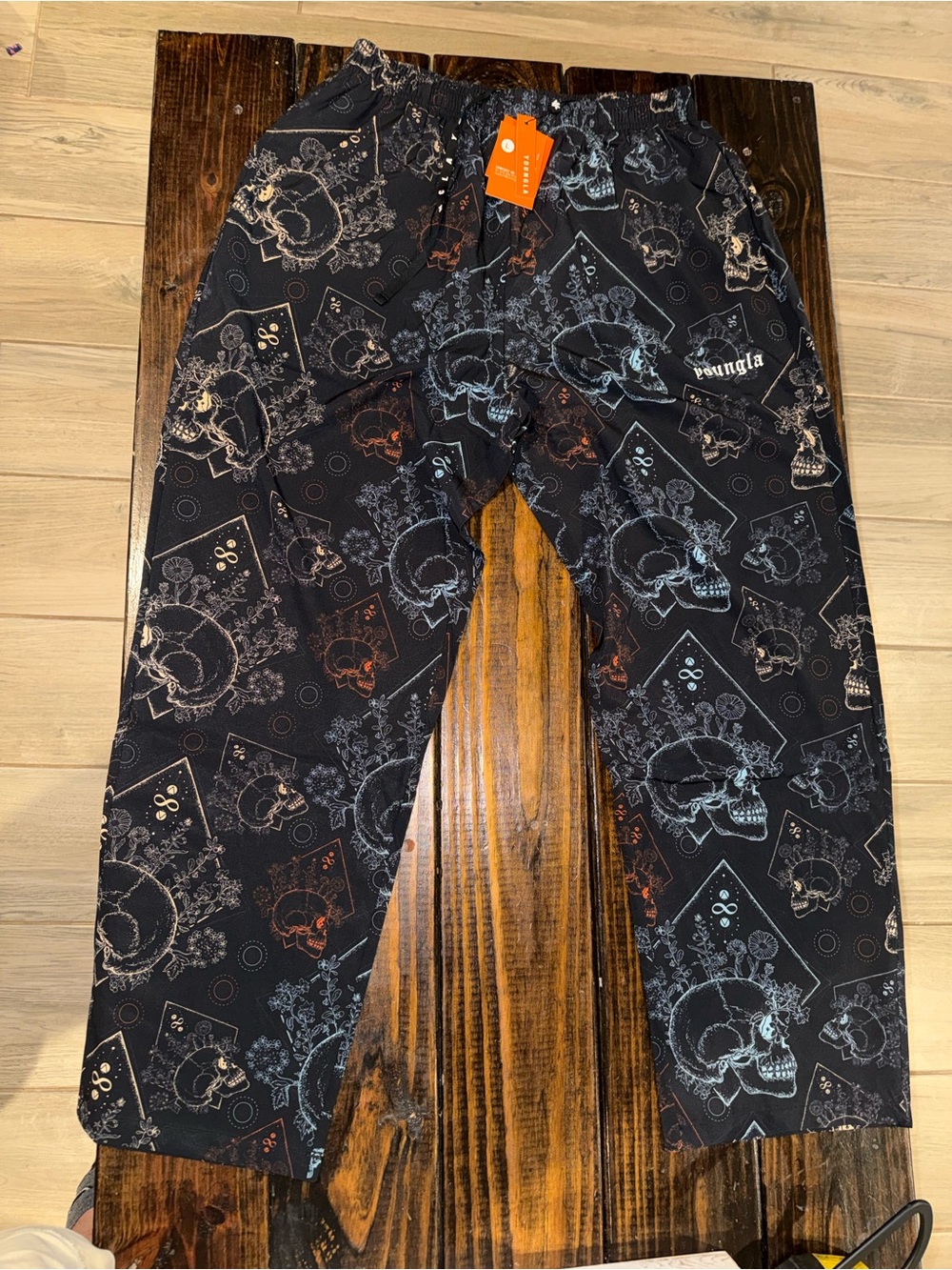 Young LA black loose fit pants with multicolor skulls and crossbones